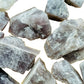 Side perspective of Anhydrite raw stone, showing raw matrix, for Meditation and Stress Relief.