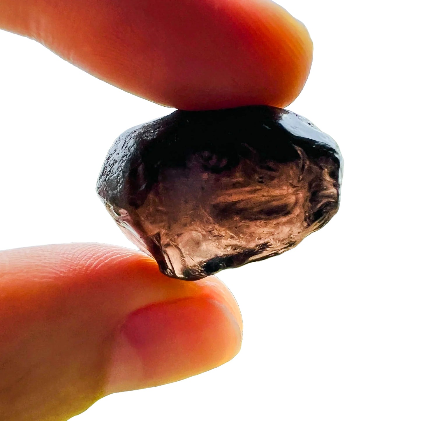 Sideways view of Grade AA Apache Tear raw stone, from United States, showing earthy tone.