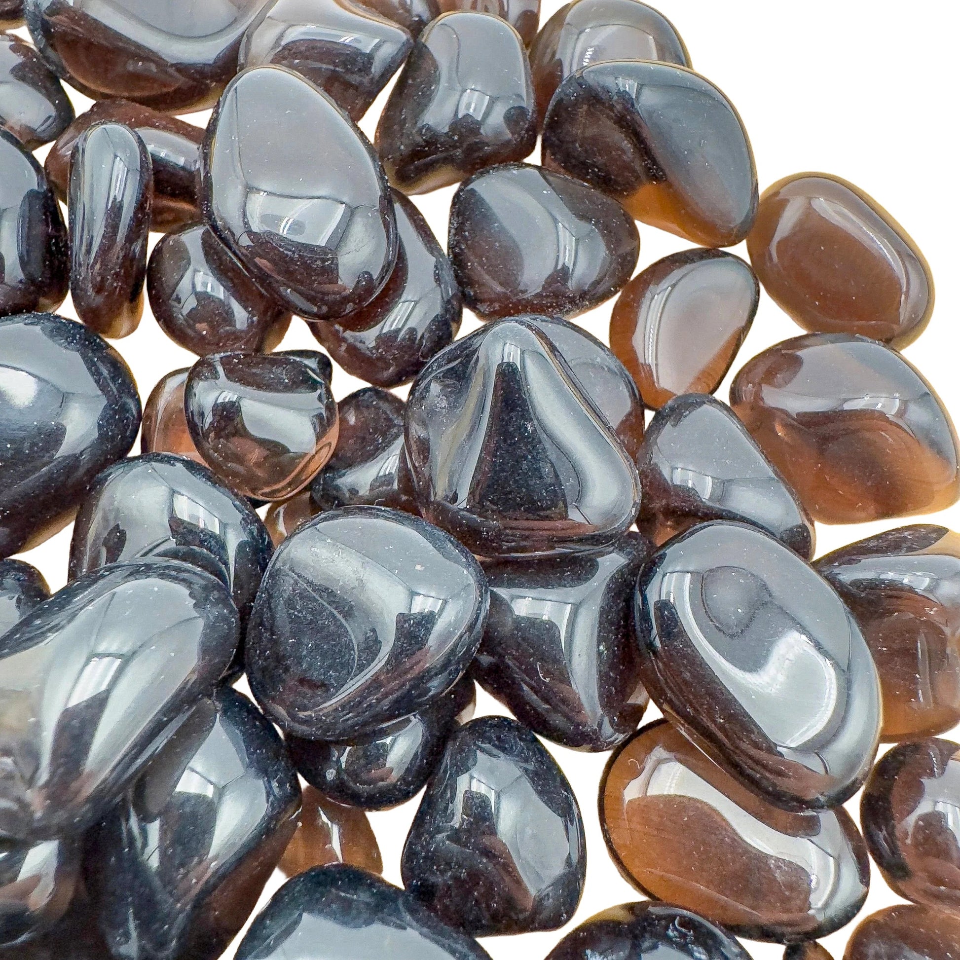 Color detail of Apache Tear tumbled stone, sourced from United States, often kept for Grounding and Protection.