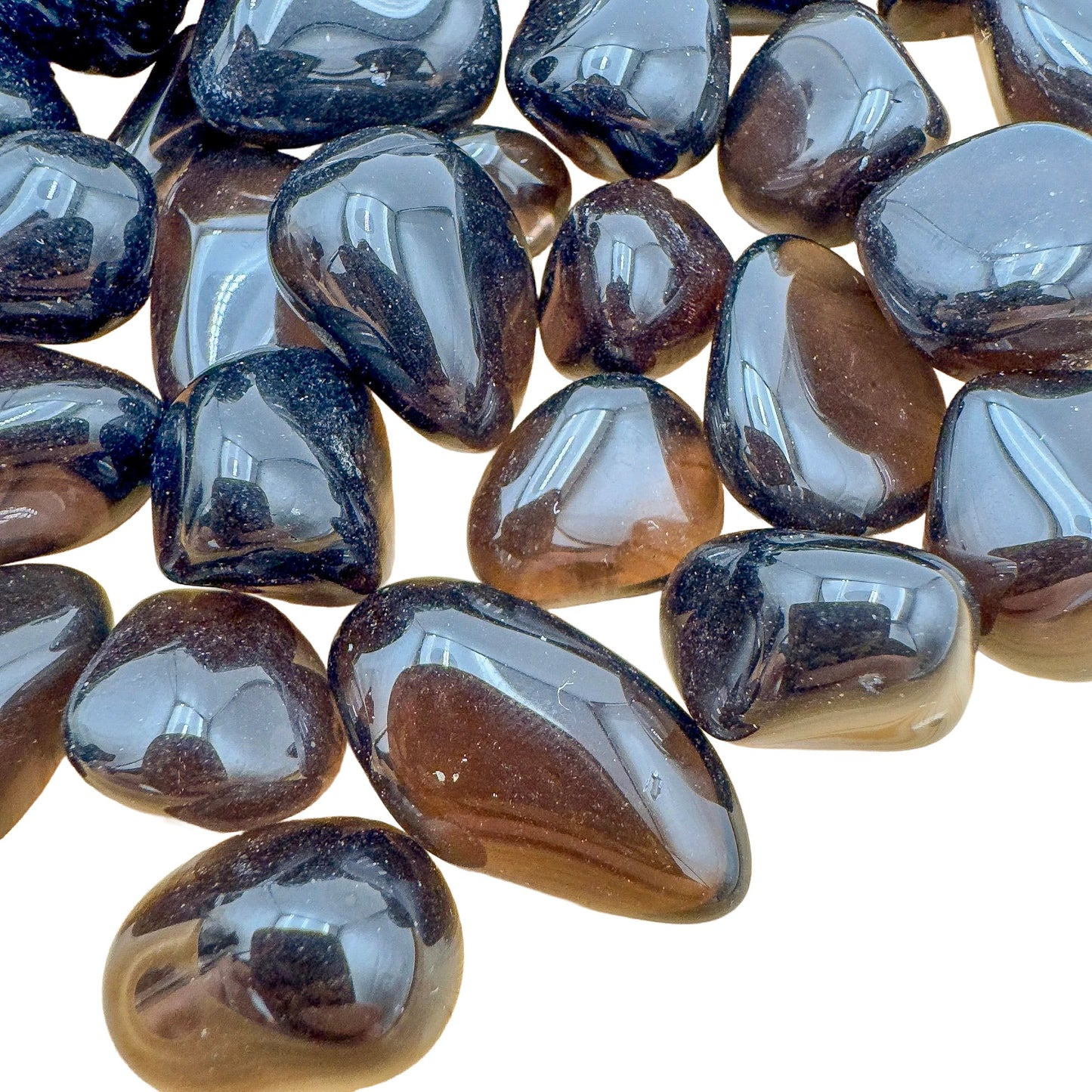 Overhead angle of Apache Tear tumbled stone, showing characteristic finish, often paired with practices around Grounding.
