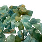 Grade a aquamarine raw held in hand for size reference