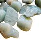 Natural light view of a Aquamarine tumbled stone kept near for Stress Relief.