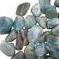 Top view of Grade A Aquamarine tumbled stone, often paired with practices around Stress Relief.