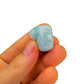 Detail shot of Grade A Aquamarine tumbled stone under natural light