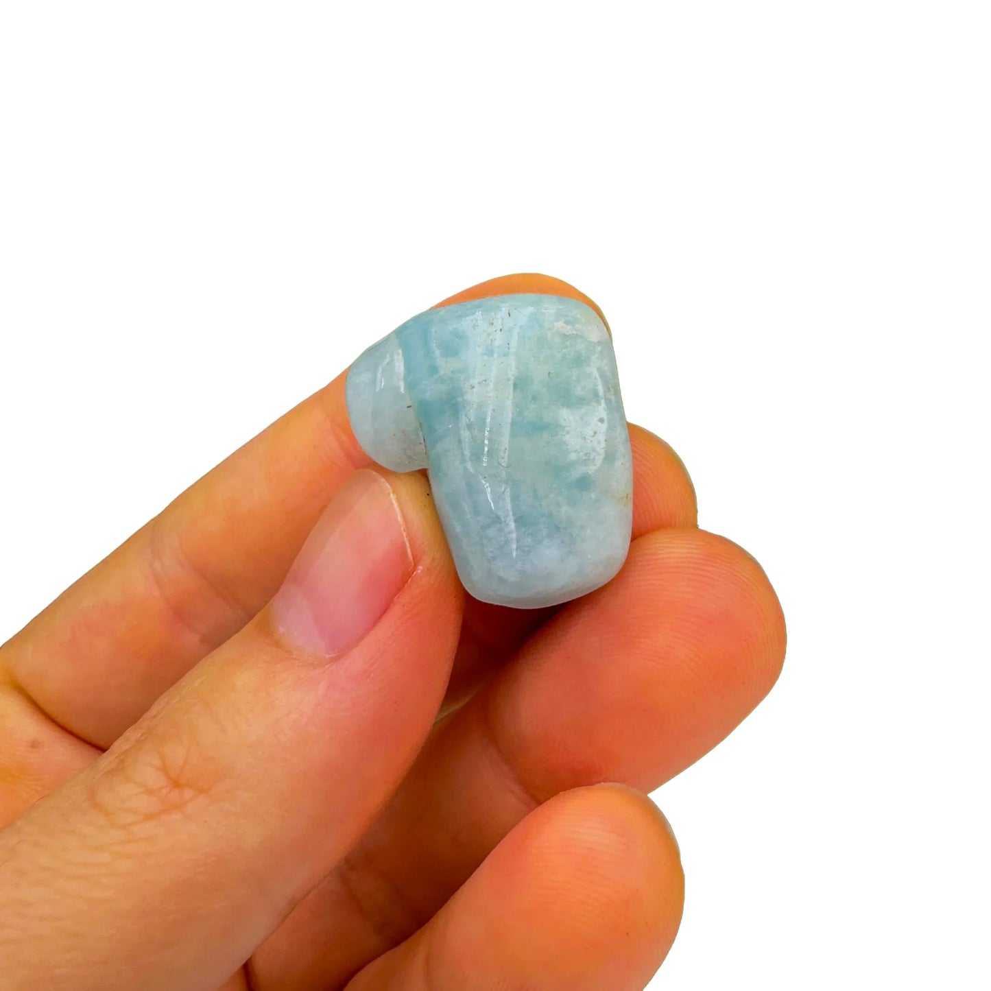 Detail shot of Grade A Aquamarine tumbled stone under natural light
