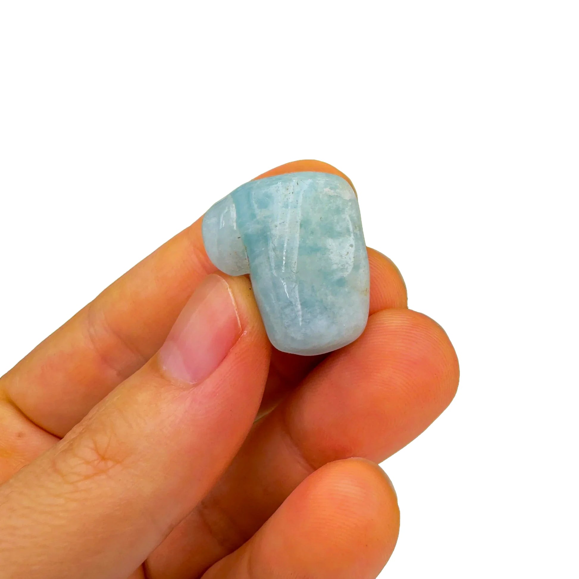 Detail shot of Grade A Aquamarine tumbled stone under natural light