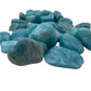 Side profile of Aquamarine tumbled stone, showing translucent edges.