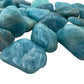 Scale reference of a Aquamarine tumbled stone often paired with practices around Stress Relief.