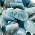 Detail capture of Grade AAA Aquamarine tumbled stone, hand-selected from Minas Gerais, Brazil.