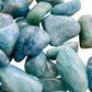 Top view of Aquamarine tumbled stone, sourced from Minas Gerais, Brazil, often worked with for Stress Relief.