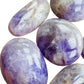 Bottom side of Banded Amethyst palm stone, showing translucent edges, kept near for Stress Relief and Sleep.