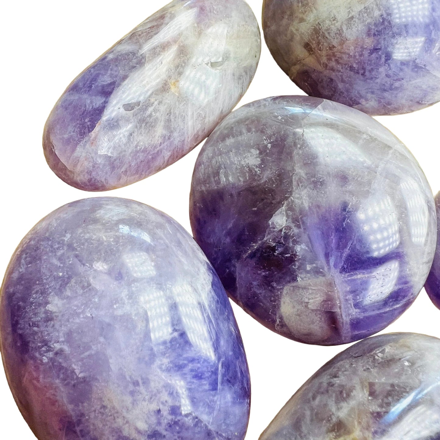 Bottom side of Banded Amethyst palm stone, showing translucent edges, kept near for Stress Relief and Sleep.