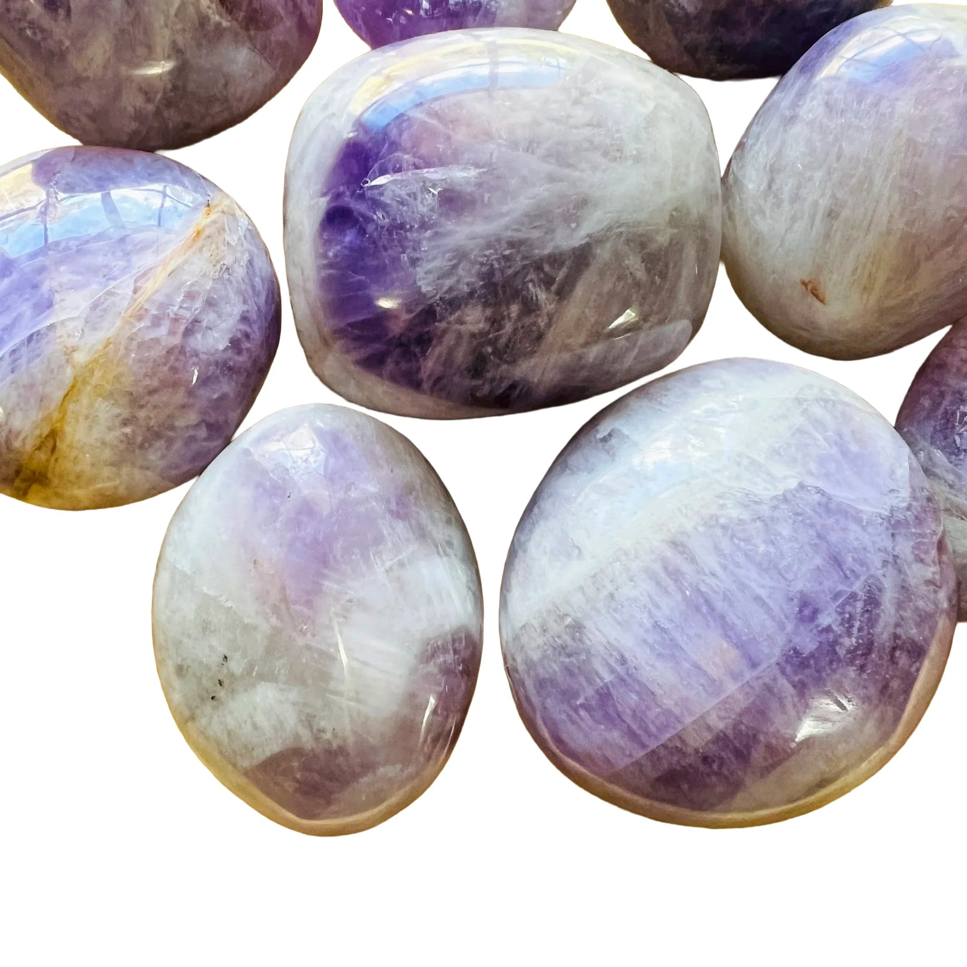 Daylight view of a Banded Amethyst palm stone held against natural backdrop.