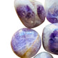 Detail shot of Grade A Banded Amethyst palm stone under natural light