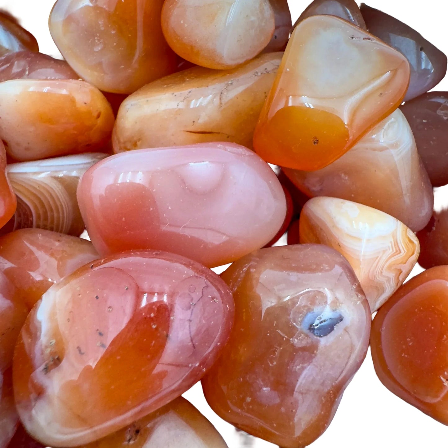 Plan view of Carnelian tumbled stone, showing earthy tone, Botswana-sourced.