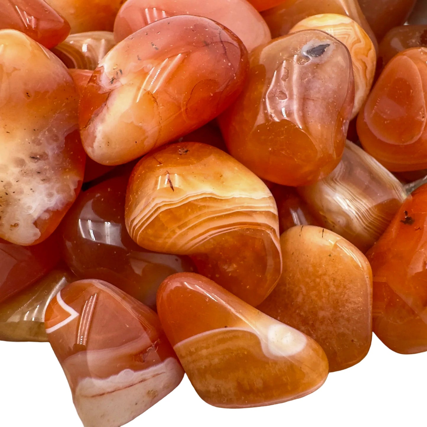 Alternate side of Carnelian tumbled stone, from Francistown, Botswana, showing natural inclusions.