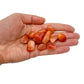 Back view of Grade AA Carnelian tumbled stone showing natural surface