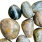 Sideways view of Black Moonstone tumbled stone, showing color depth.