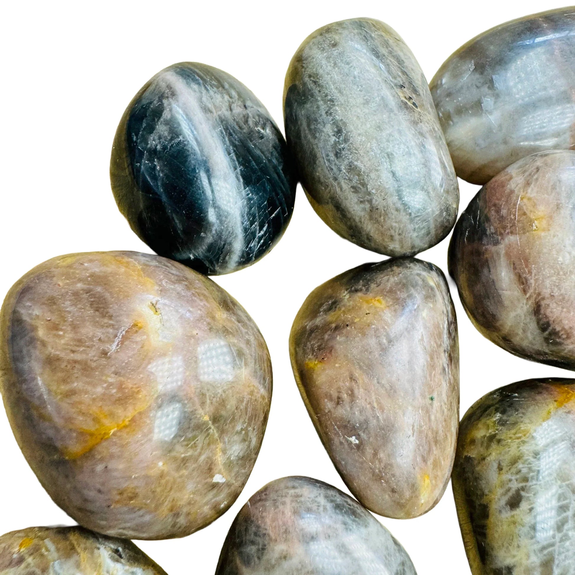 Sideways view of Black Moonstone tumbled stone, showing color depth.