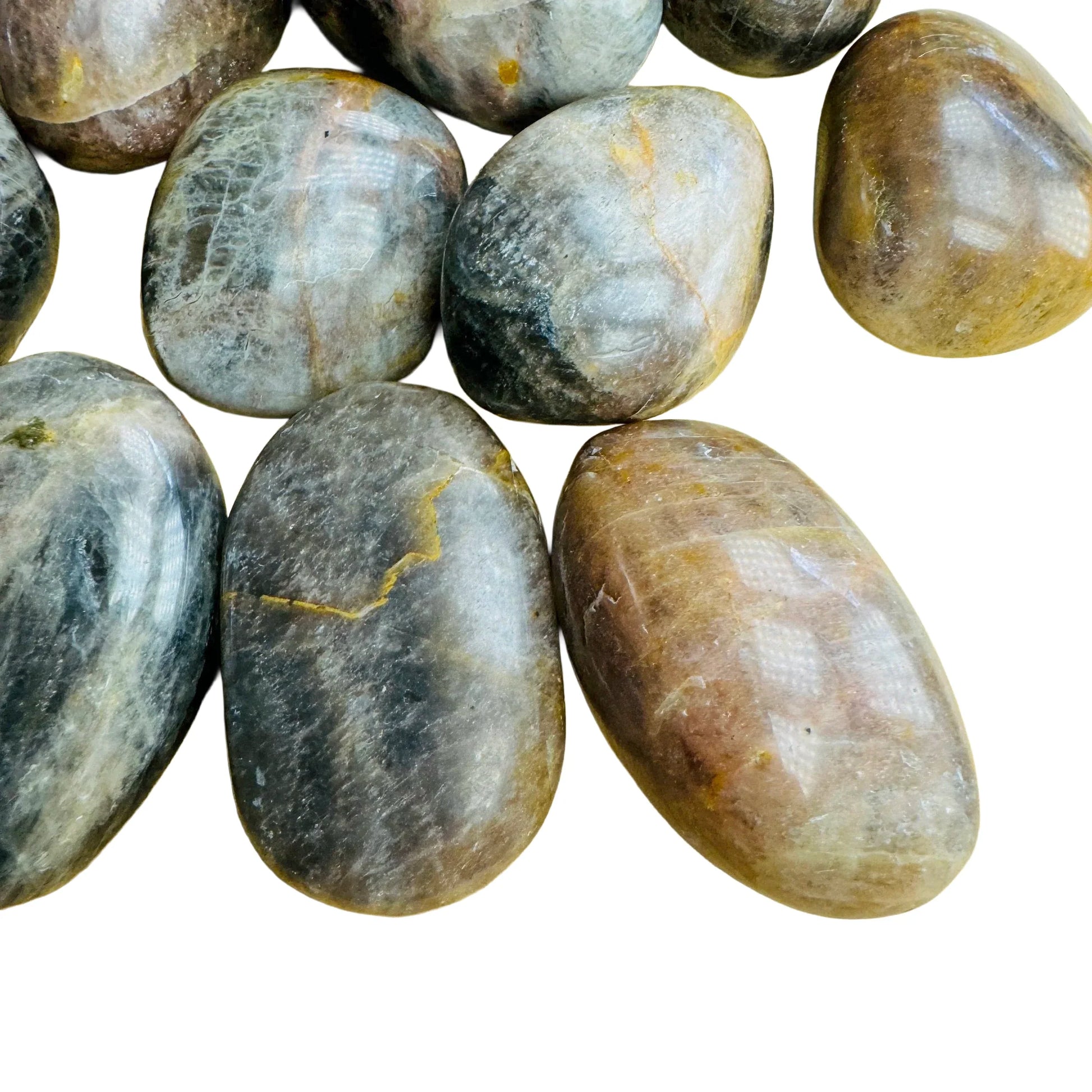 Top-side view of Grade AA Black Moonstone tumbled stone, showing glassy finish, kept close for Grounding.