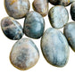 Alternate side of Grade AA Black Moonstone tumbled stone, showing color depth.