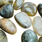 Edge-on view of Black Moonstone tumbled stone, Madagascar-sourced.