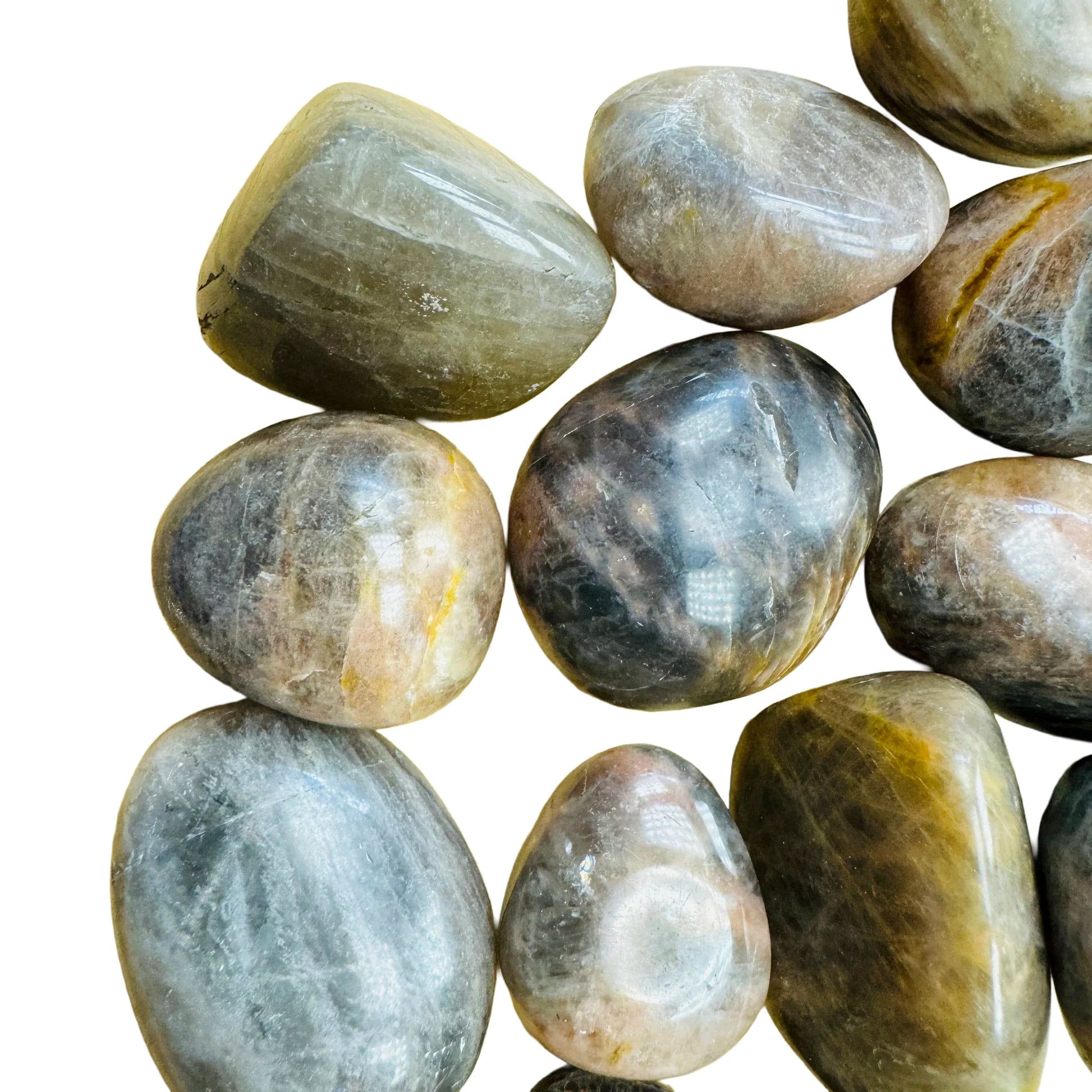 Top-down shot of Black Moonstone tumbled stone, sourced from Madagascar.