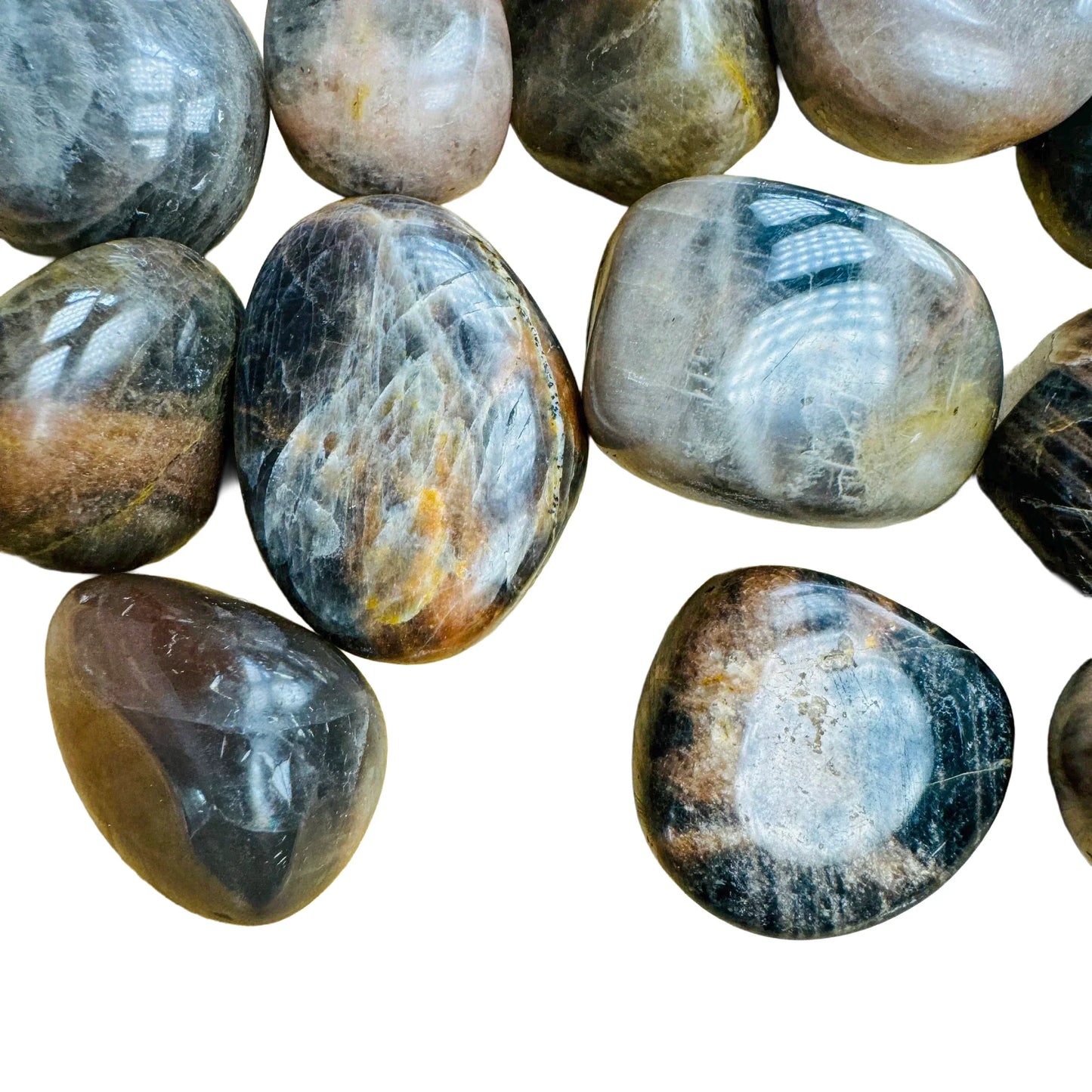 Palm-scale view of a Black Moonstone tumbled stone, Madagascar-sourced, Madagascar-sourced.