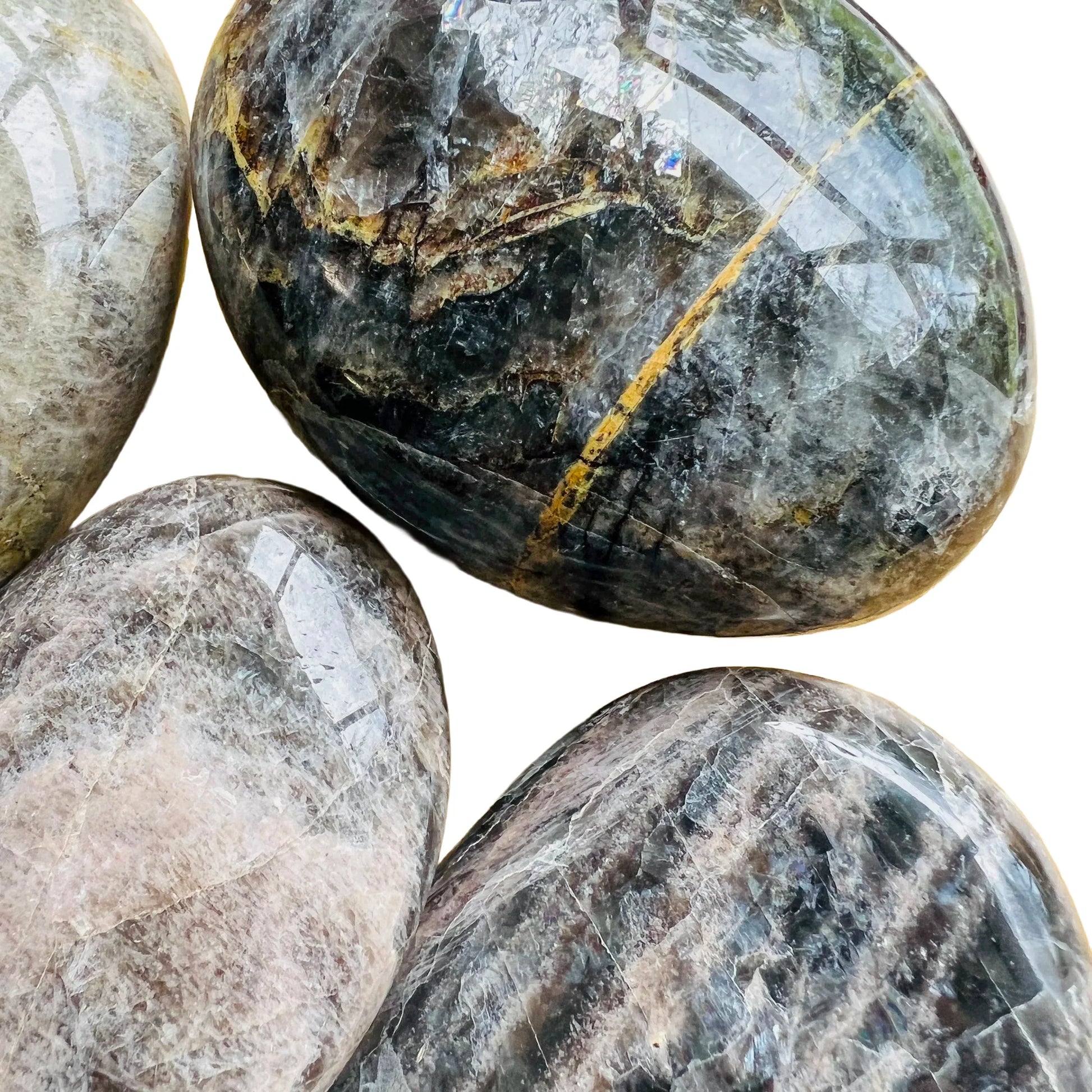 Opposite side of Black Moonstone palm stone, from Amoron'i Mania, Madagascar, traditionally used for Grounding and Protection.