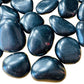 Macro view of Black Obsidian tumbled stone, Argentina-sourced, traditionally used for Protection.