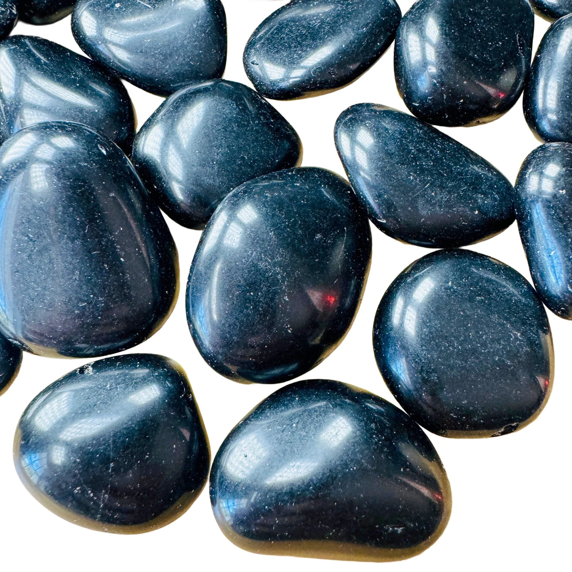 Macro view of Black Obsidian tumbled stone, Argentina-sourced, traditionally used for Protection.