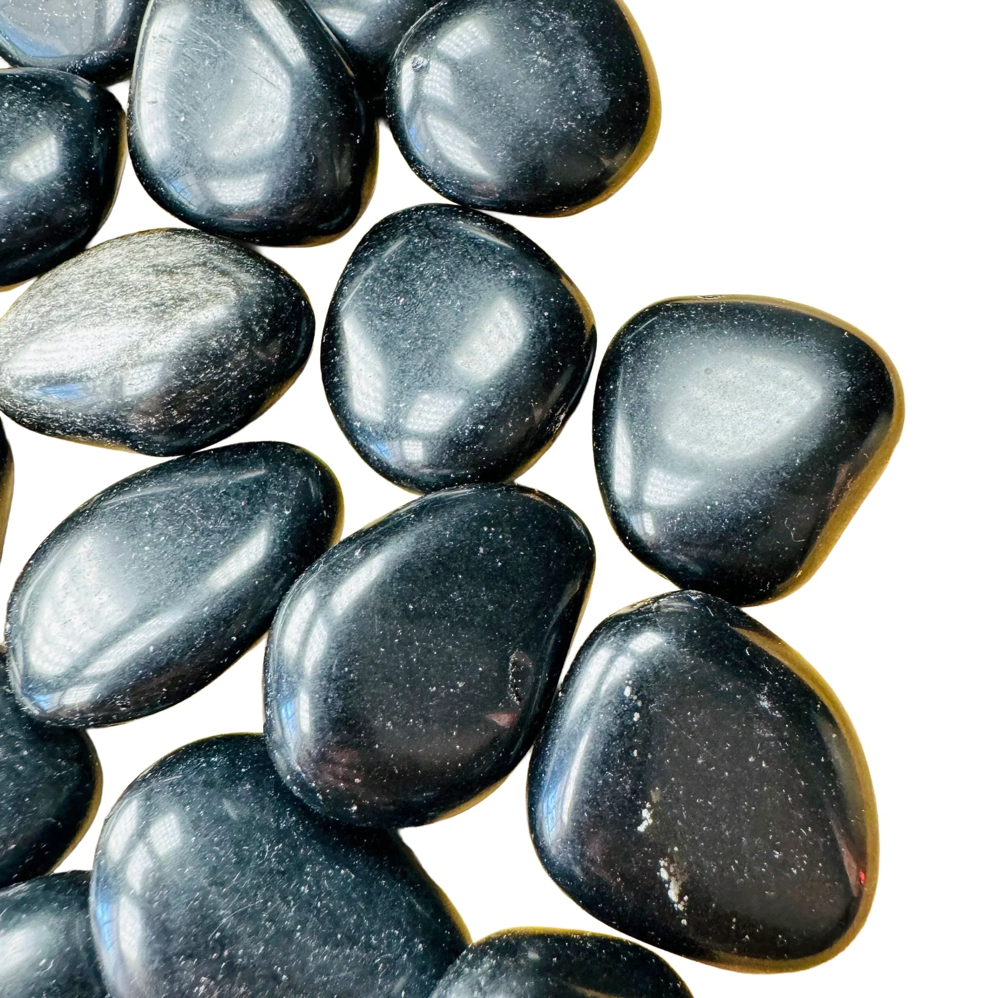 Reverse side of Grade AA Black Obsidian tumbled stone, often worked with for Protection and Grounding, sourced from Salta.