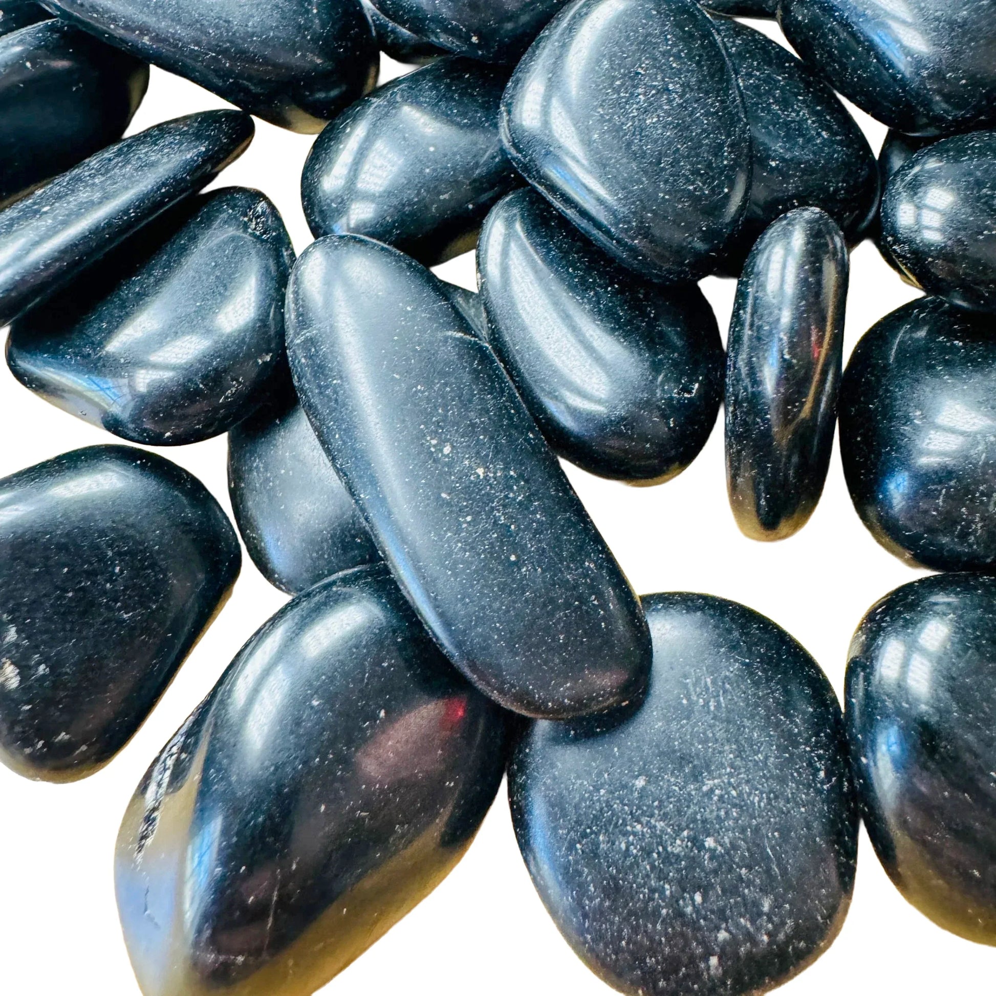 Macro view of Black Obsidian tumbled stone, showing natural sheen.