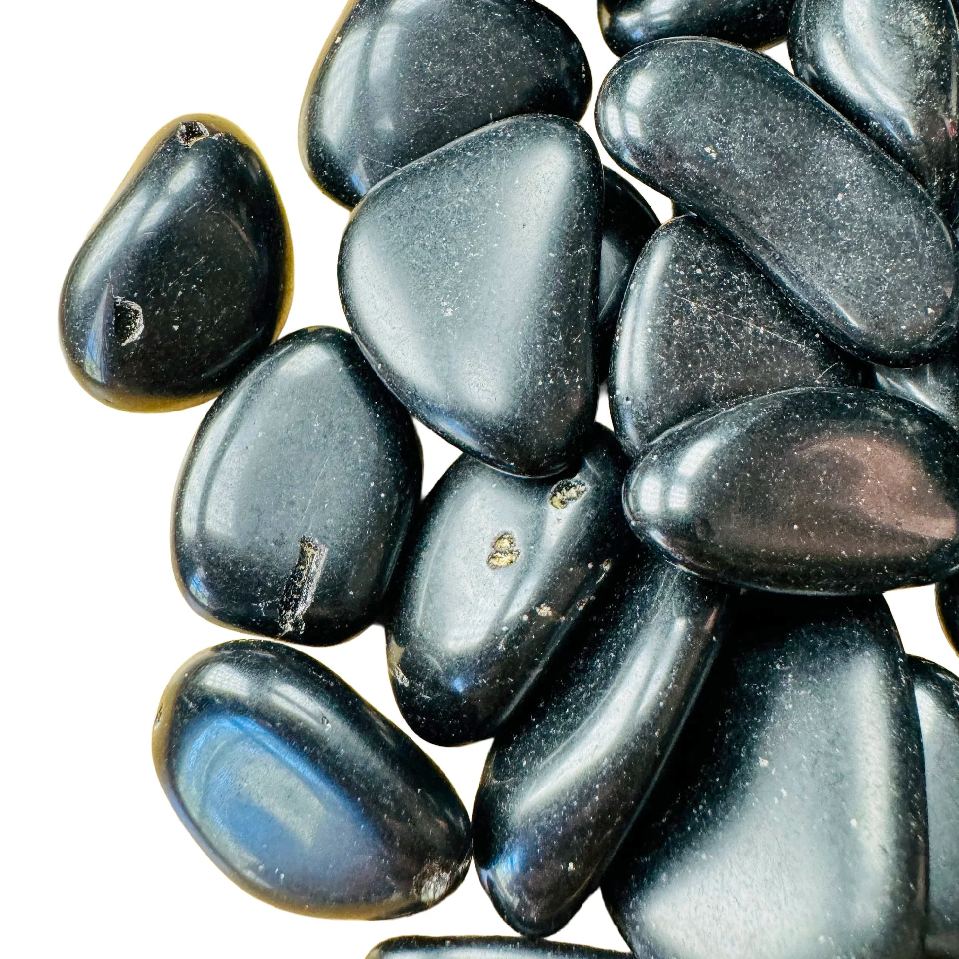 Profile shot of Black Obsidian tumbled stone, traditionally used for Protection, hand-selected from Salta Province, Argentina.