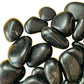 Top view of Black Obsidian tumbled stone, hand-selected from Salta Province, Argentina, linked to Protection.