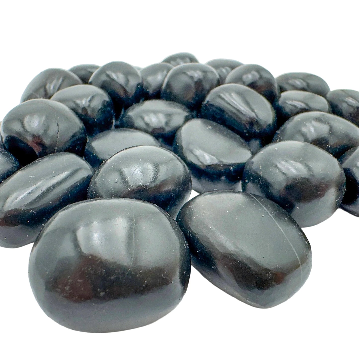 Detail capture of Grade AA Black Onyx tumbled stone, showing natural variation.