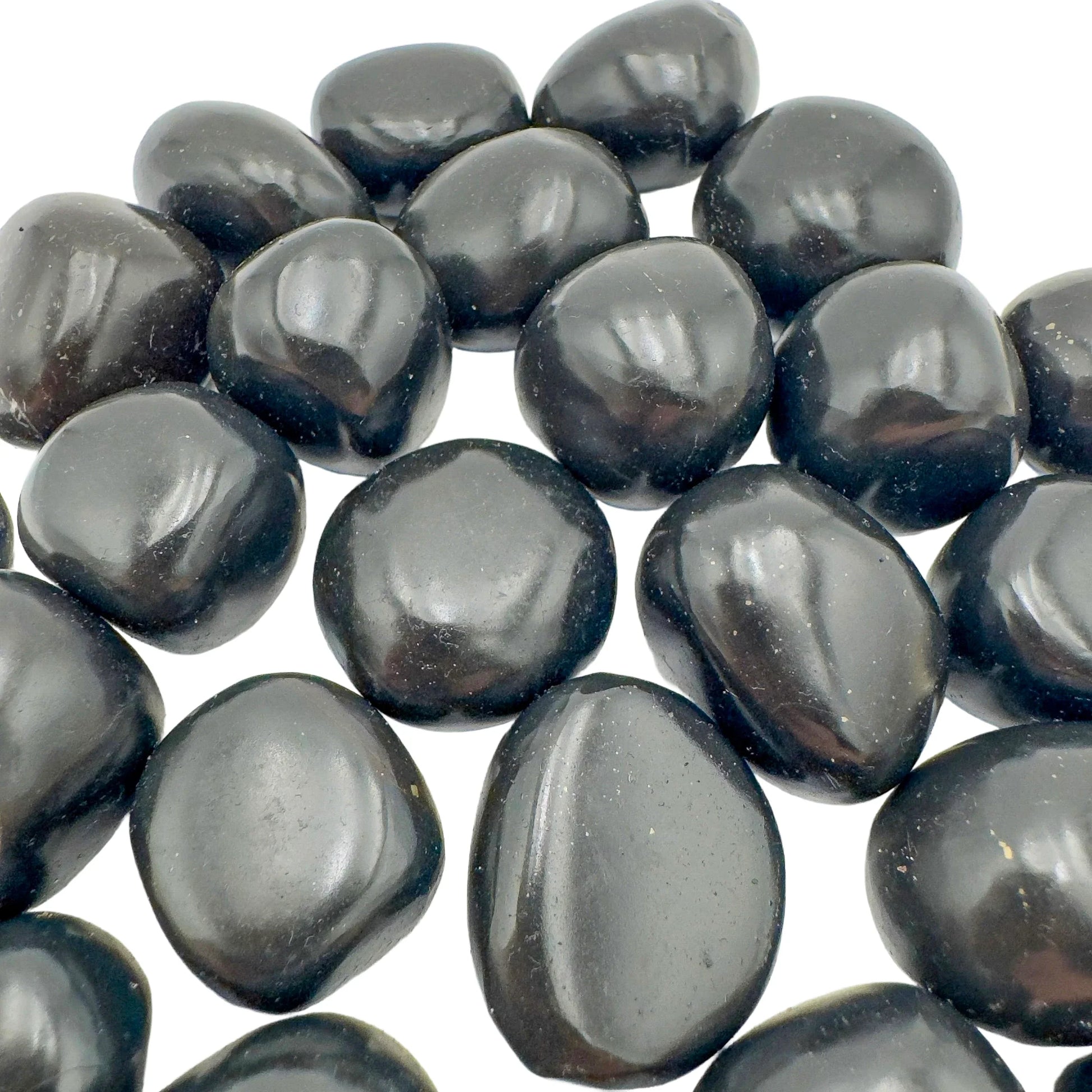 Bottom side of Black Onyx tumbled stone, to support Protection and Grounding, sourced from Ancash, Peru.