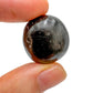 Display context of Black Onyx tumbled stone, from Ancash, Peru, showing the wear and finish.