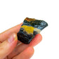 Grade a black onyx raw held in hand for size reference