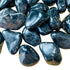 Up-close view of Grade AA Black Onyx tumbled stone, from Brazil, showing subtle veining.