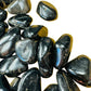 Side-on view of Black Onyx tumbled stone, kept near for Protection, Brazil-sourced.