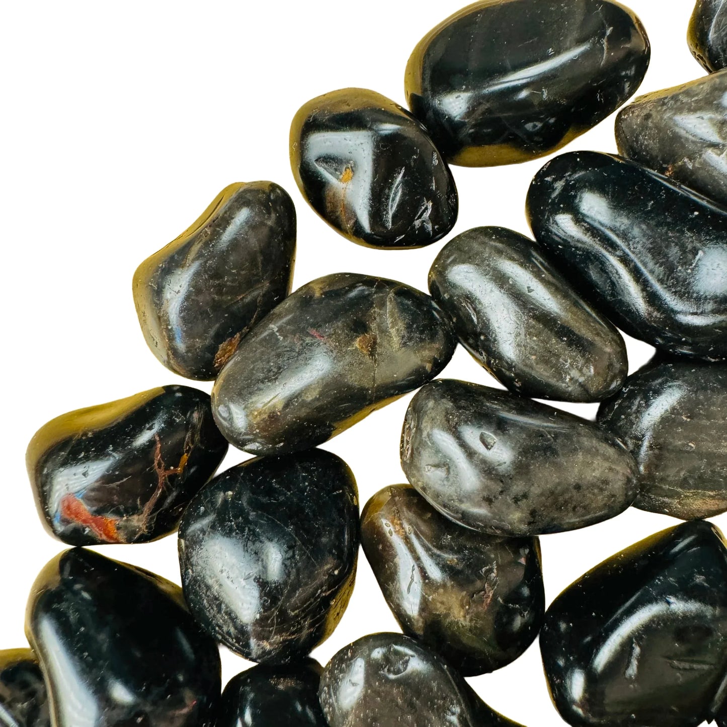 Overhead view of Grade AA Black Onyx tumbled stone, showing natural texture, from Minas Gerais, Brazil.