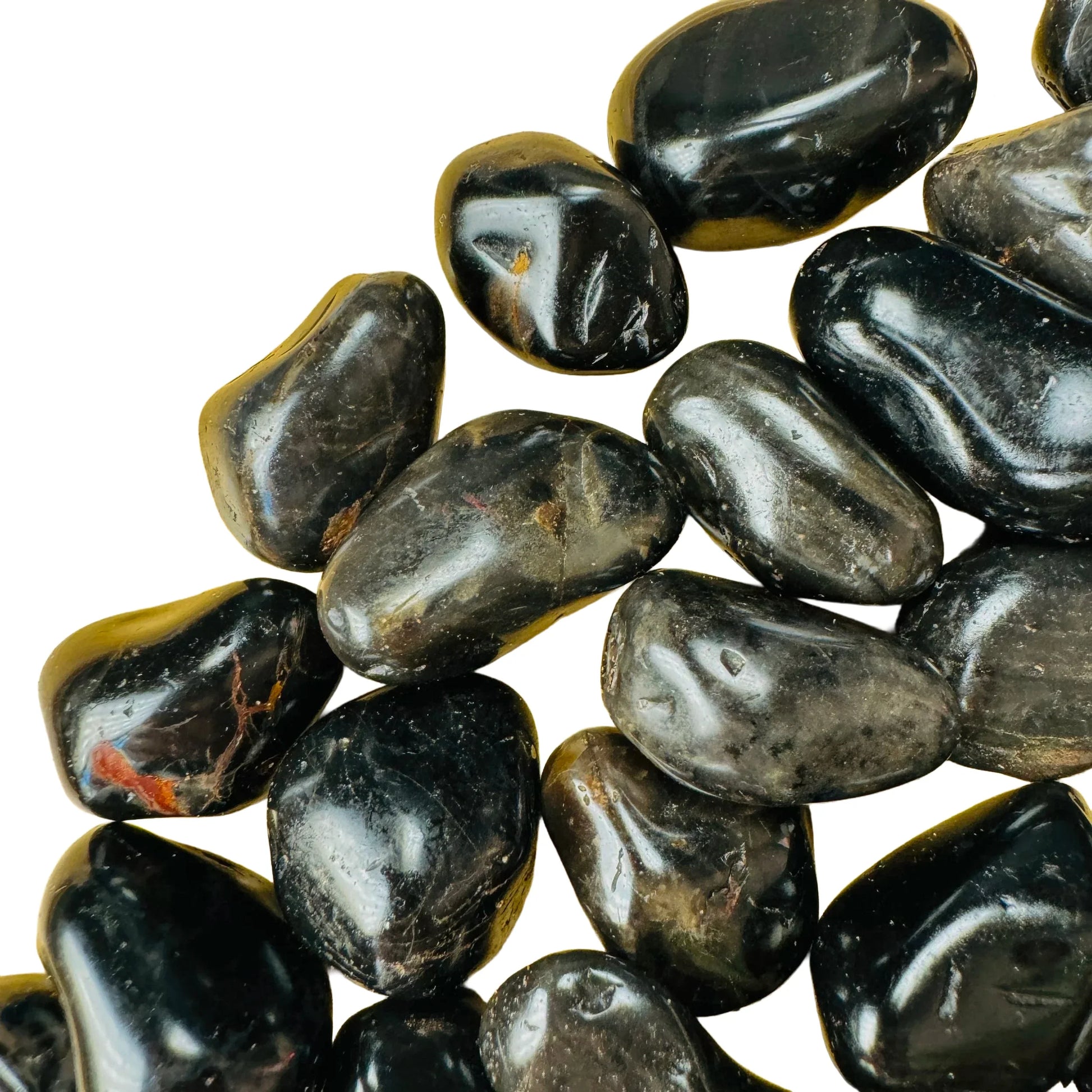 Overhead view of Grade AA Black Onyx tumbled stone, showing natural texture, from Minas Gerais, Brazil.