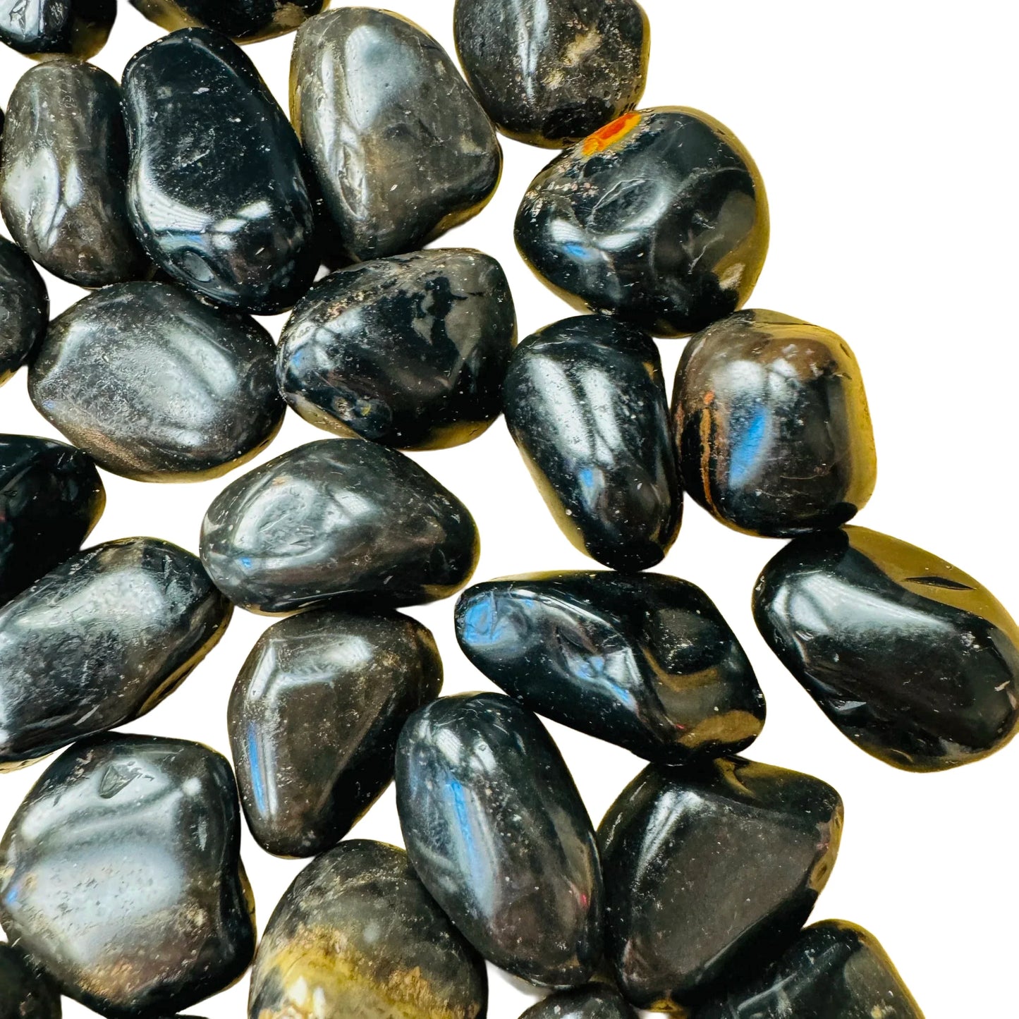 Bottom side of Black Onyx tumbled stone, drawn on for Protection, showing natural sheen.