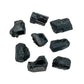 Profile view of Black Tourmaline raw stone, linked to Protection and Grounding.
