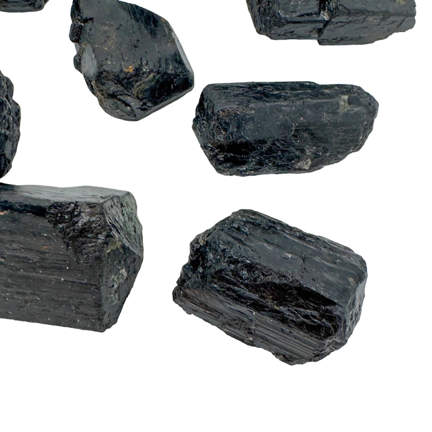 Back view of Grade AA Black Tourmaline raw stone, showing natural form, sourced from Vakinankaratra, Madagascar.