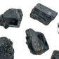 Daylight view of one Black Tourmaline raw stone for scale, Madagascar-sourced, from Vakinankaratra, Madagascar.