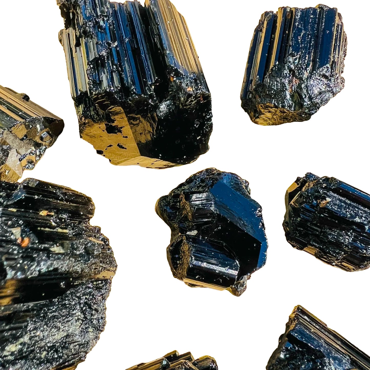 Grade aaa black tourmaline raw held in hand for size reference