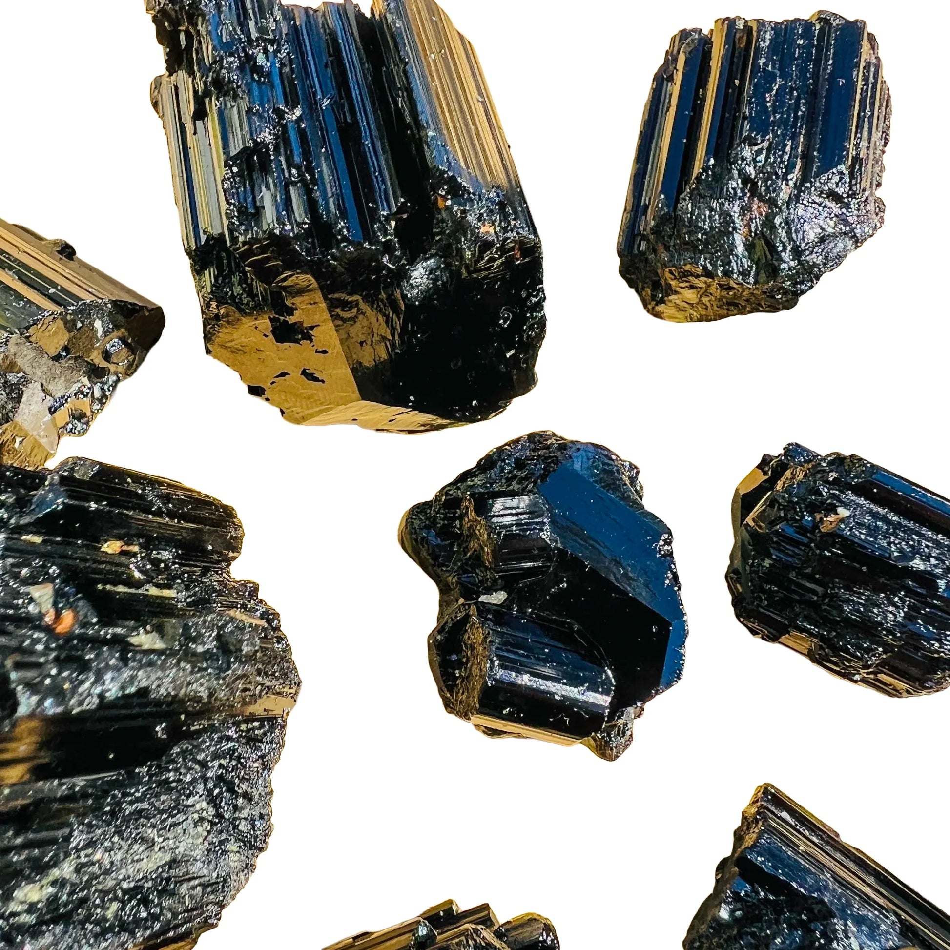 Grade aaa black tourmaline raw held in hand for size reference