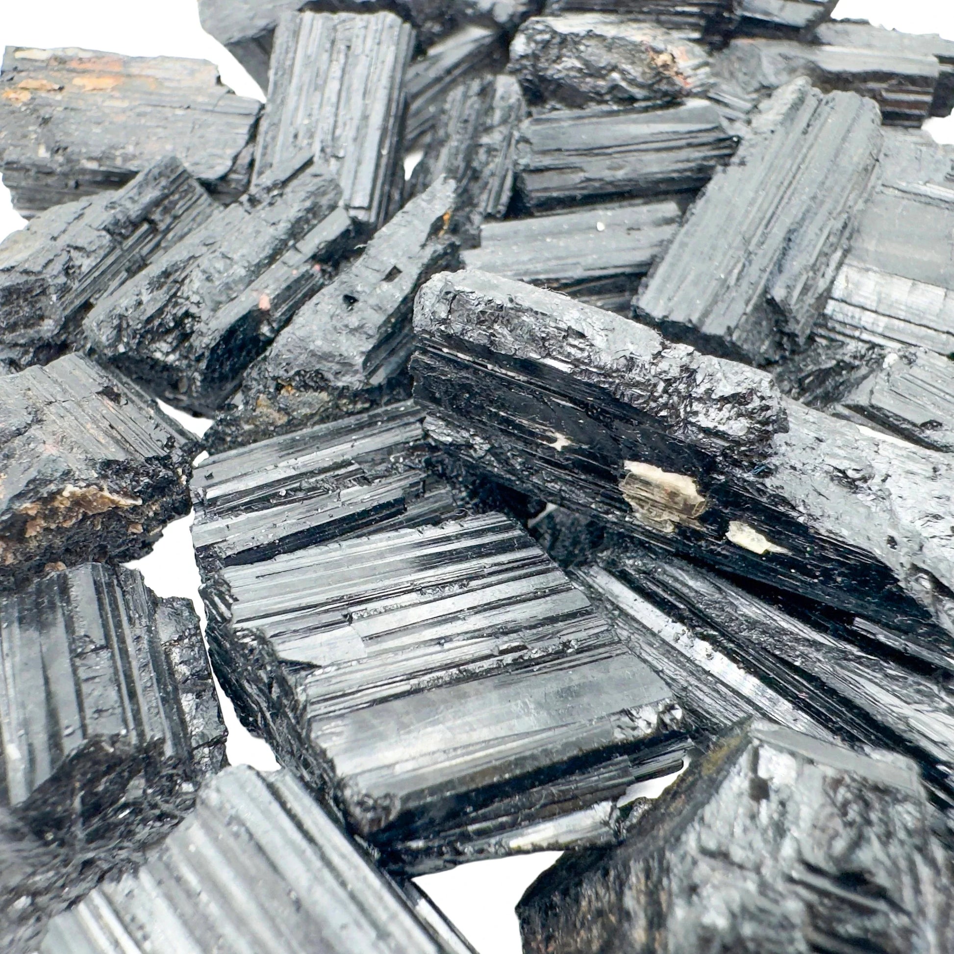 In-hand view of a Black Tourmaline raw stone, from Minas Gerais, Brazil.